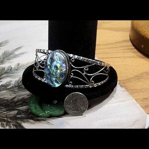 Intricate Silver Bracelet with Vibrant Abalone